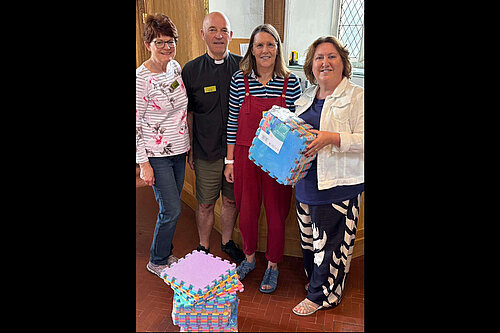 Councillor Jane Carr at St Peter and St Paul's Church in Newport Pagnell with new play mats provided by her ward budget