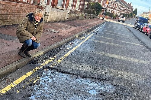 Jude by a huge pothole on Simonside