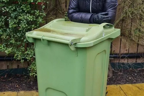 Julia Potts with wheelie bin