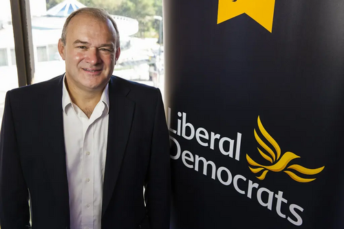 Ed Davey with Banner