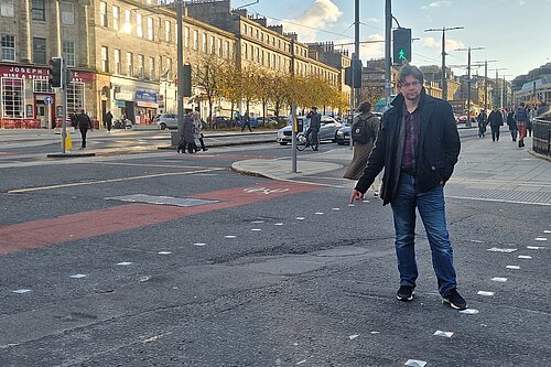 A man pointing at a sunken crossing