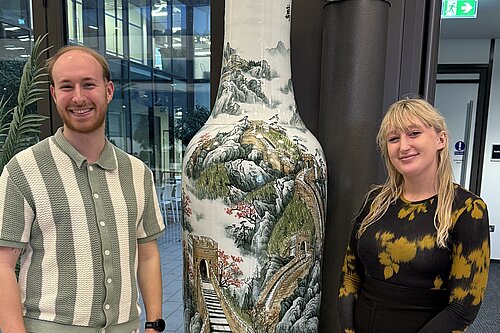 Rory Clark and Yasmin Deter alongside some art