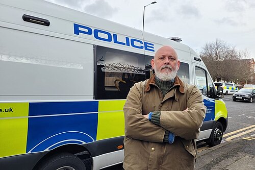 Terry Stacy outside police van