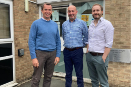 Calum Miller in front of Woodstock Surgery