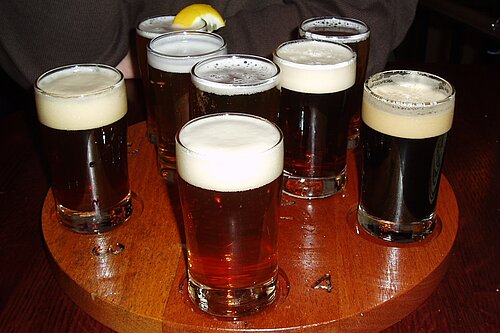 multiple beer glasses / pints