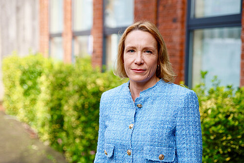 Helen in front of building