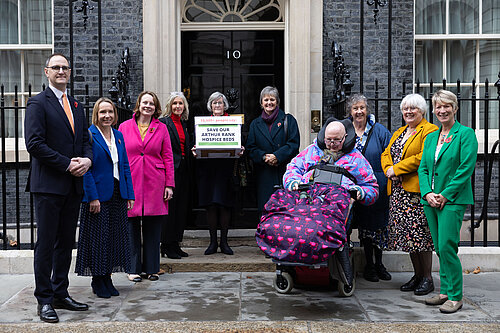 People standing outside the door of no 10 holding the petition