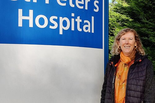 Ellen Nicholson with St Peter's Hospital sign