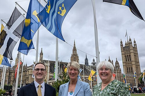 Cambridgeshire MPs Ian Sollom, Pippa Heylings and Charlotte Cane with Flags