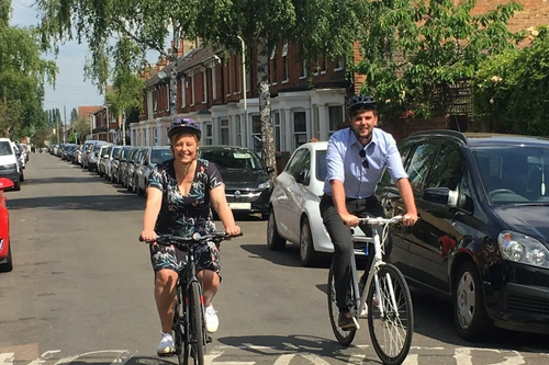 Cllr Hilde Hendrickx and Cllr Jake Sampson cycling