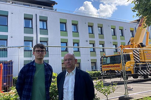 Cllrs Aldridge and Thornley at Craigievar House, a three-storey building of flats, after the fire in 2023.