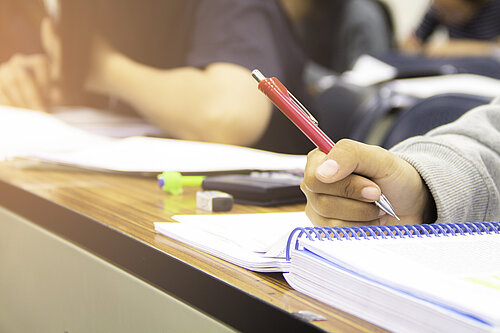 Close up of students doing school work