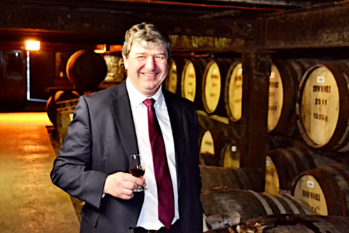 Alistair Carmichael with whisky barrels