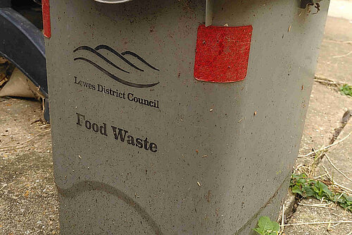 A Lewes District Council food waste bin that has clearly been well used.