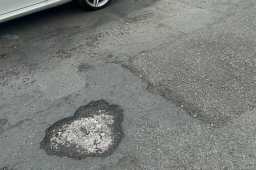 Just one of the many potholes on Oldham's streets
